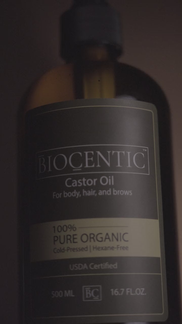 closeup shot of organic castor oil with 90 percent ricinoleic acid in a 16 fl oz glass bottle